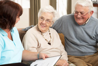 Older Couple Have Visit From Lady With Clipboard